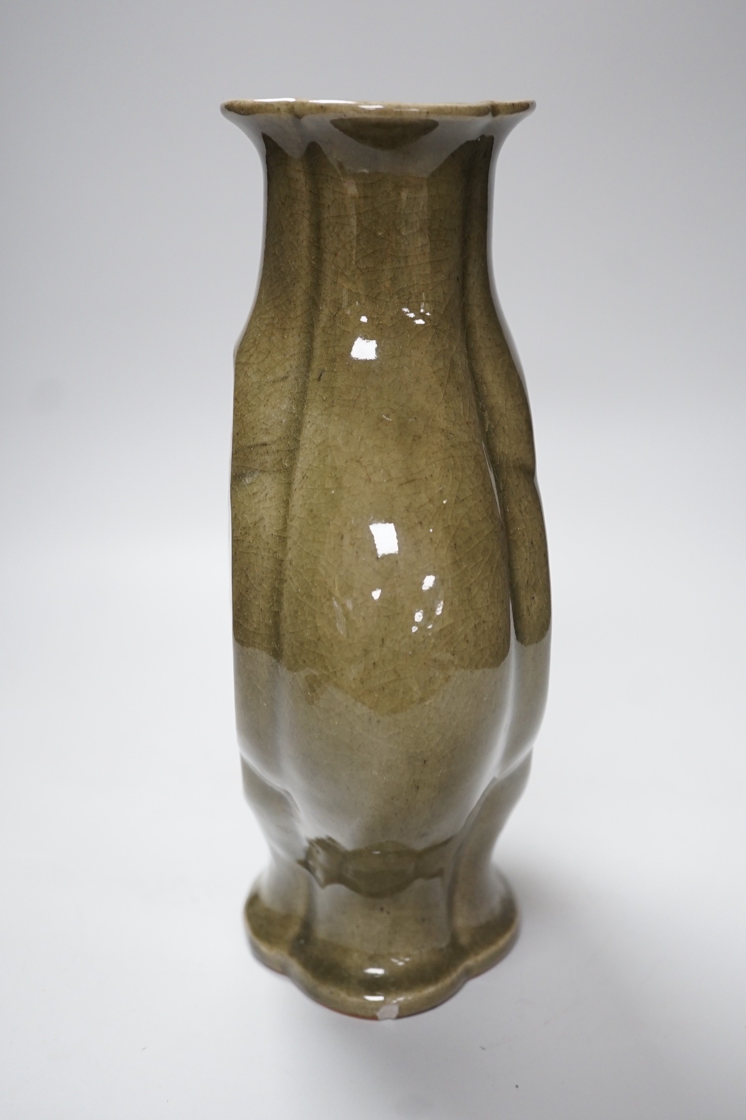 A large Chinese celadon glazed stoneware vase, incised with floral panels, 28cm